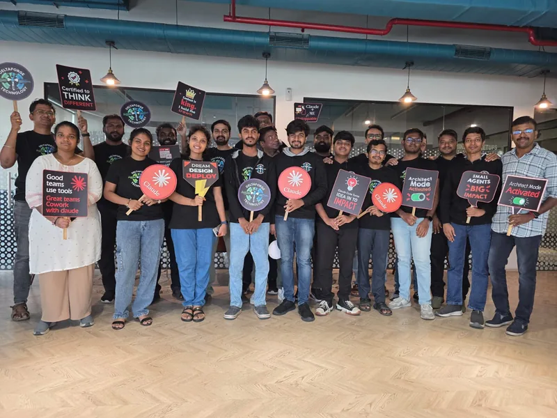 The Deltaforge team standing together with colourful technology-themed signs